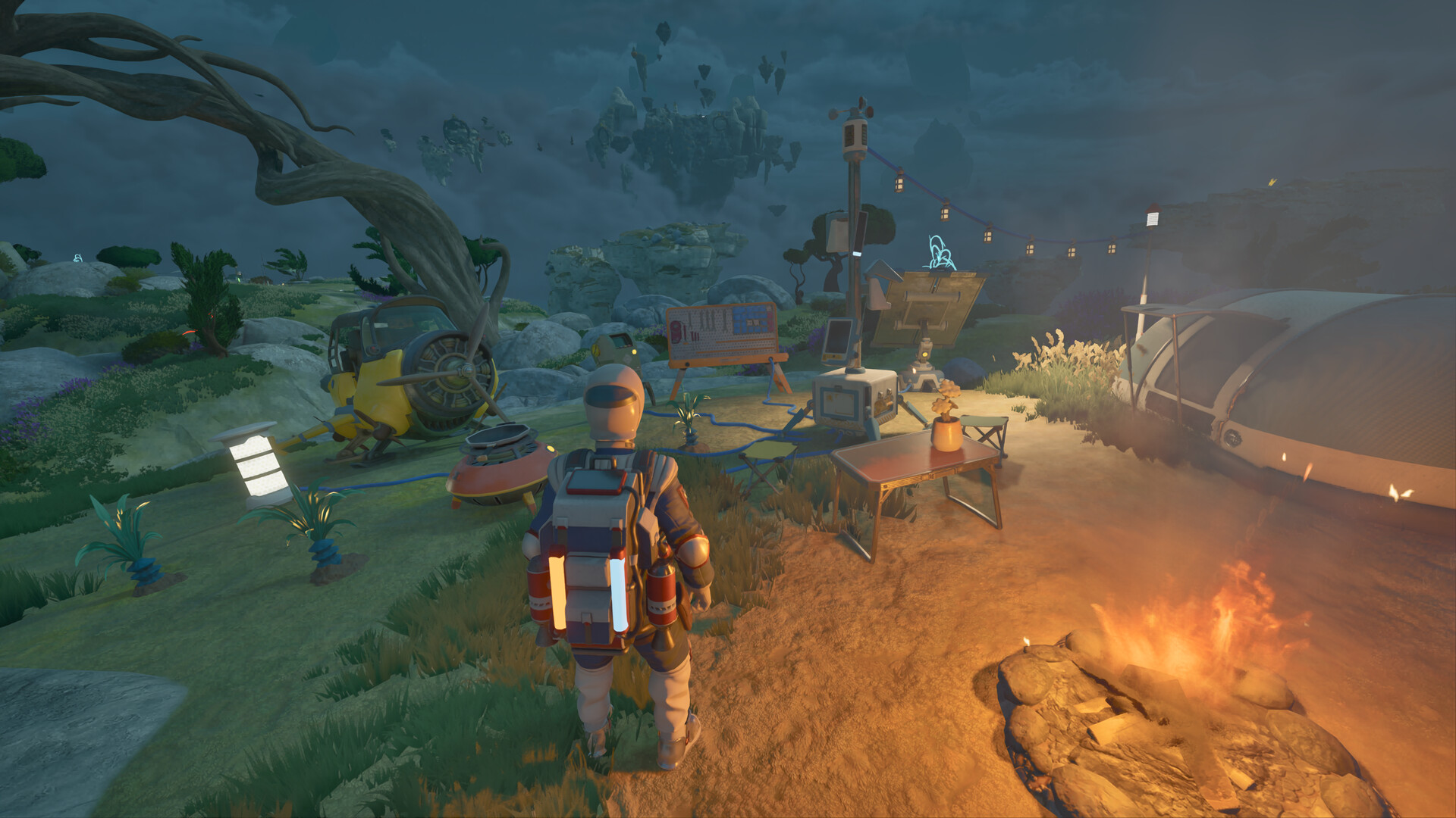 An island campsite with equipment and a parked craft at dusk